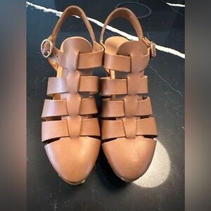 Fisherman sandals with wood heel.